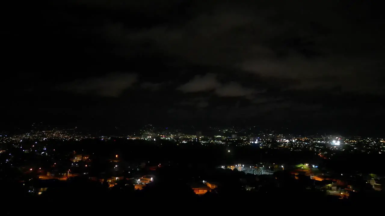 Drone Shot Pulling Away With Lightning Storm Off in the Distance