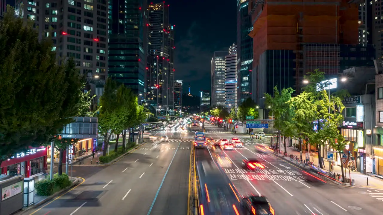 Seoul City Downtown Night Traffic Timelapse with Iconic View of Modern Skyscrapers and Namsan Tower in Yongsan District South Korea