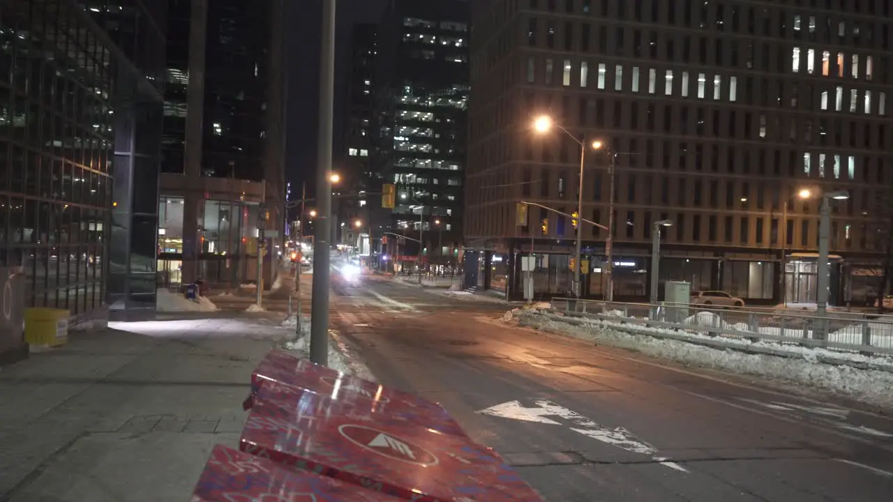 A quiet city street in the winter at night