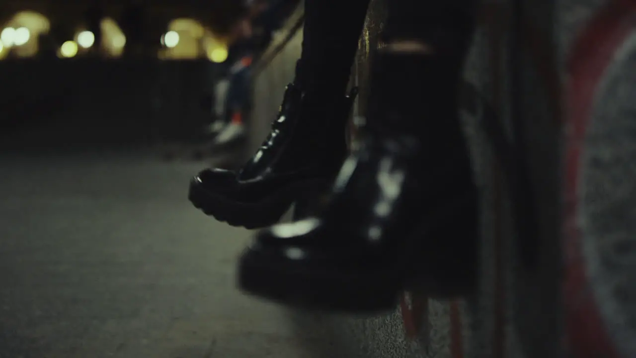 Woman shoes legs moving at late night city in urban background