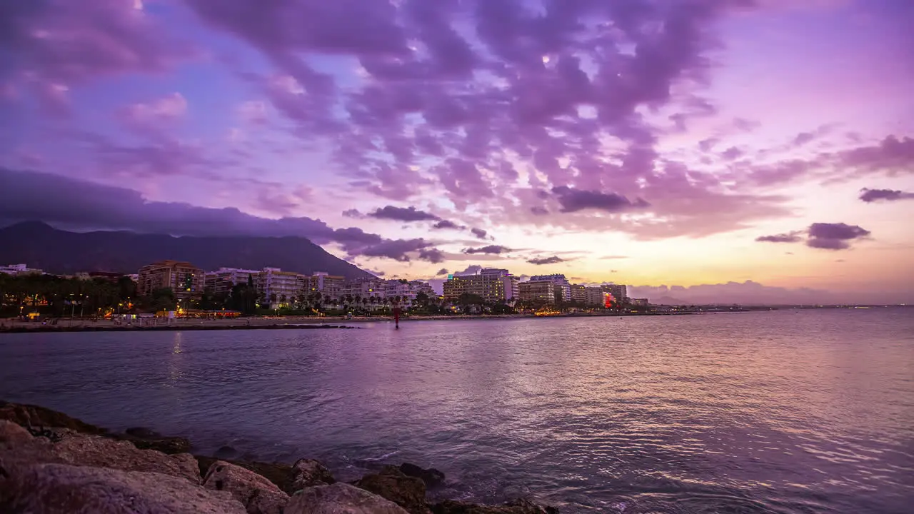 Time lapse transition night to day coast of Malaga Spain at sea