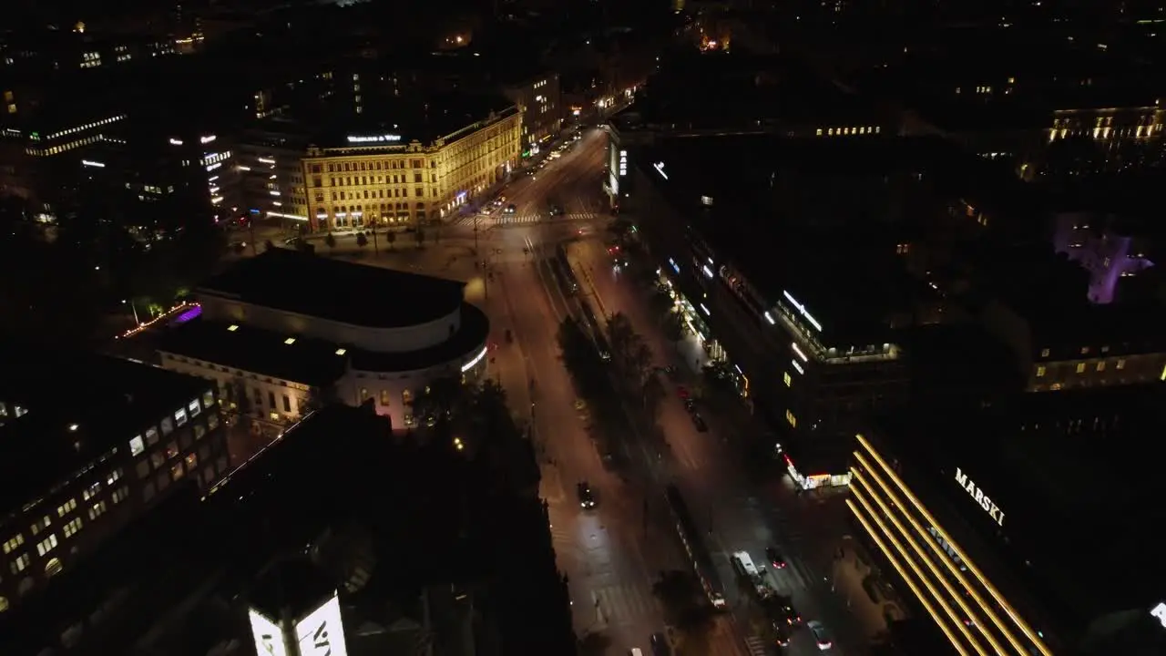 Light night city traffic in downtown Helsinki retail district Kluuvi