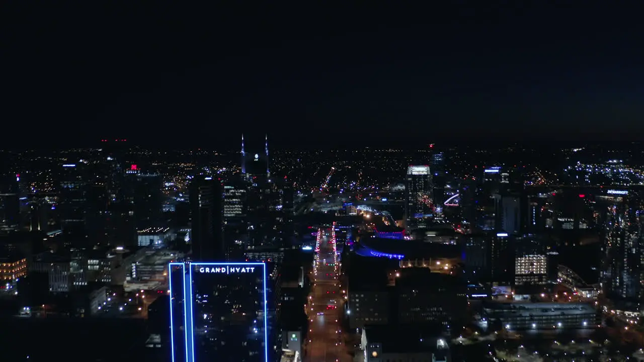 Nashville Night Time Aerial looking over broadway downtown city Drone 4K