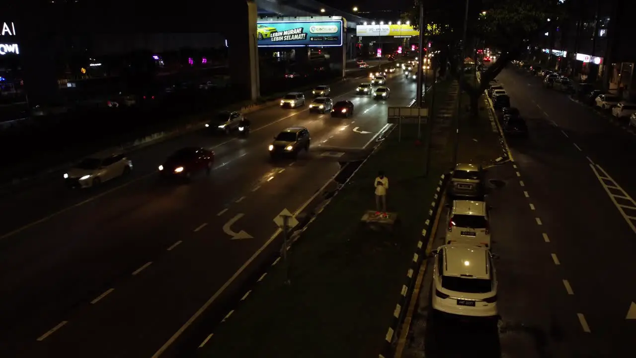 Traffic camera and busy night street of metropolis aerial view