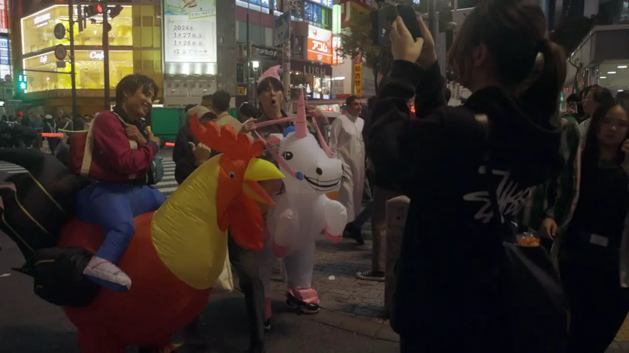 People taking Photos at Shibuya Crossing on Halloween Tokyo Japan