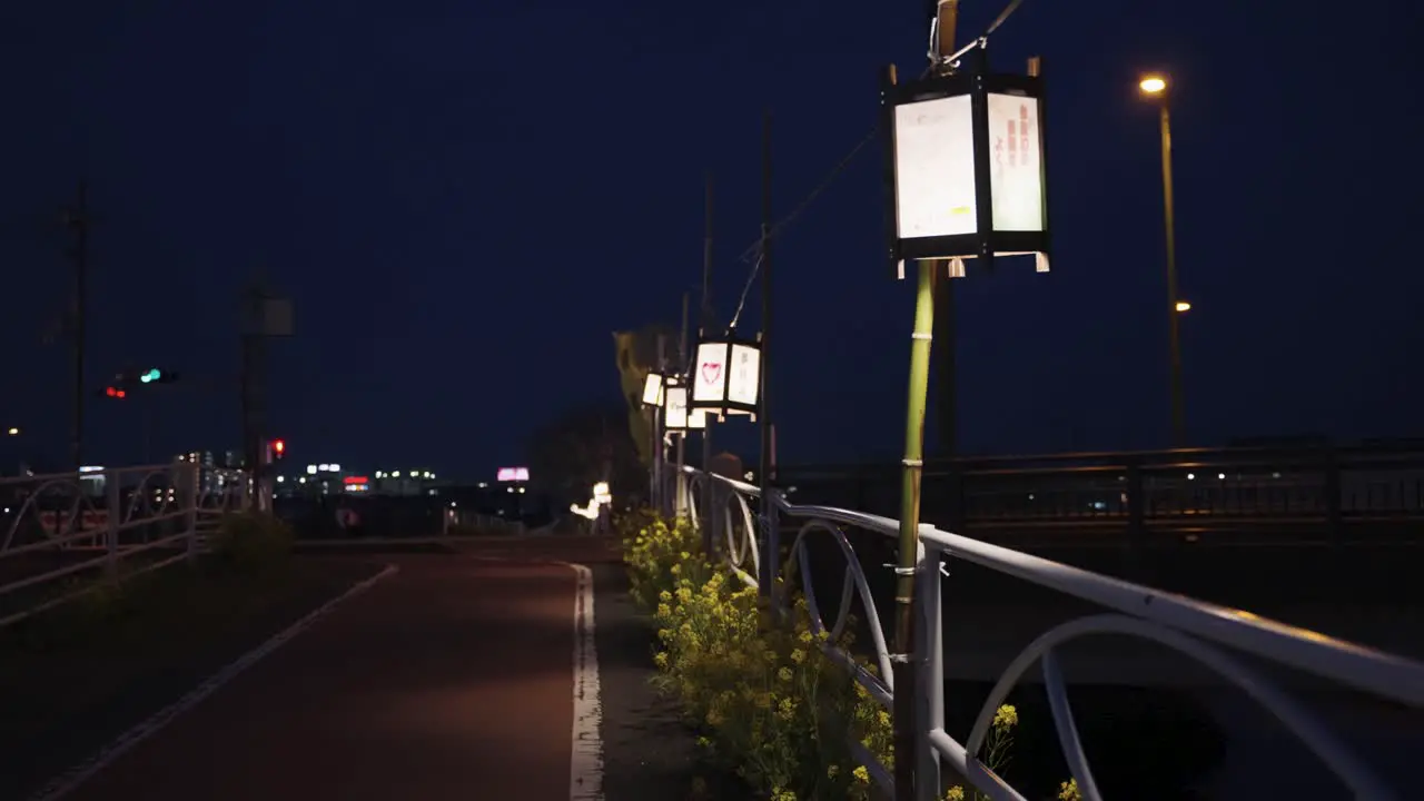 Lanterns along river at night drifting in the wind Omihachiman Japan