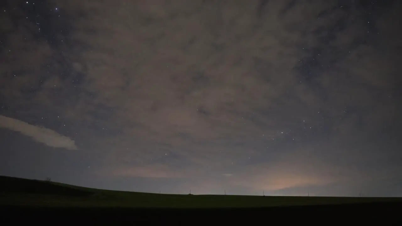 Beautiful Timelapse Of Clouds And Stars At Night low angle shot