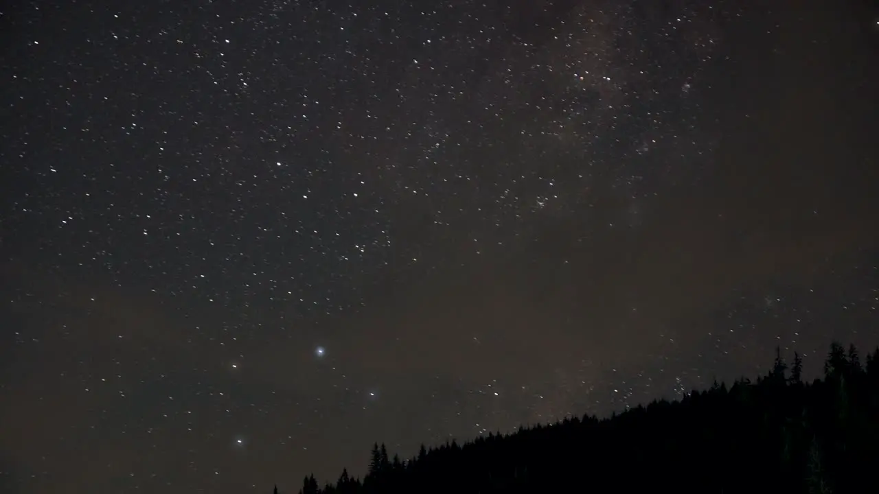 Bright Stars At The Night Sky Over The Mountains