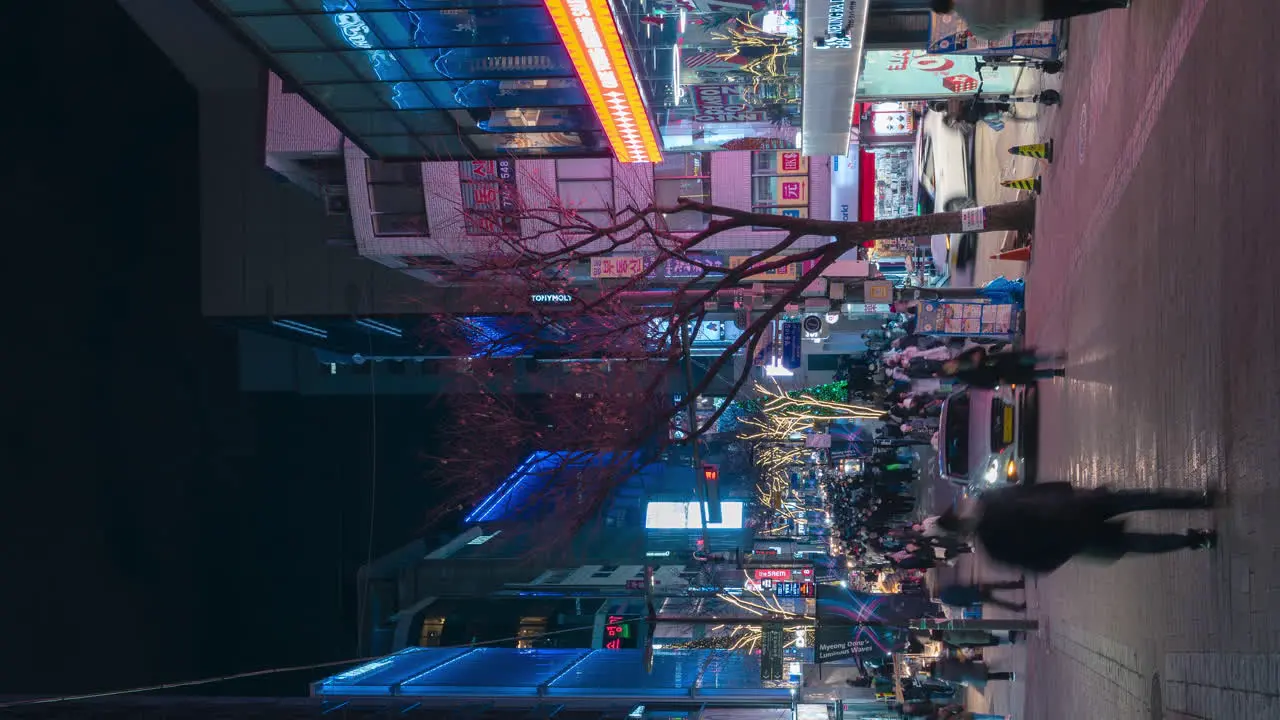 Myeongdong Night Market Vertical Time Lapse of People Shopping Walking at Pedestrian Street in Seoul South Korea