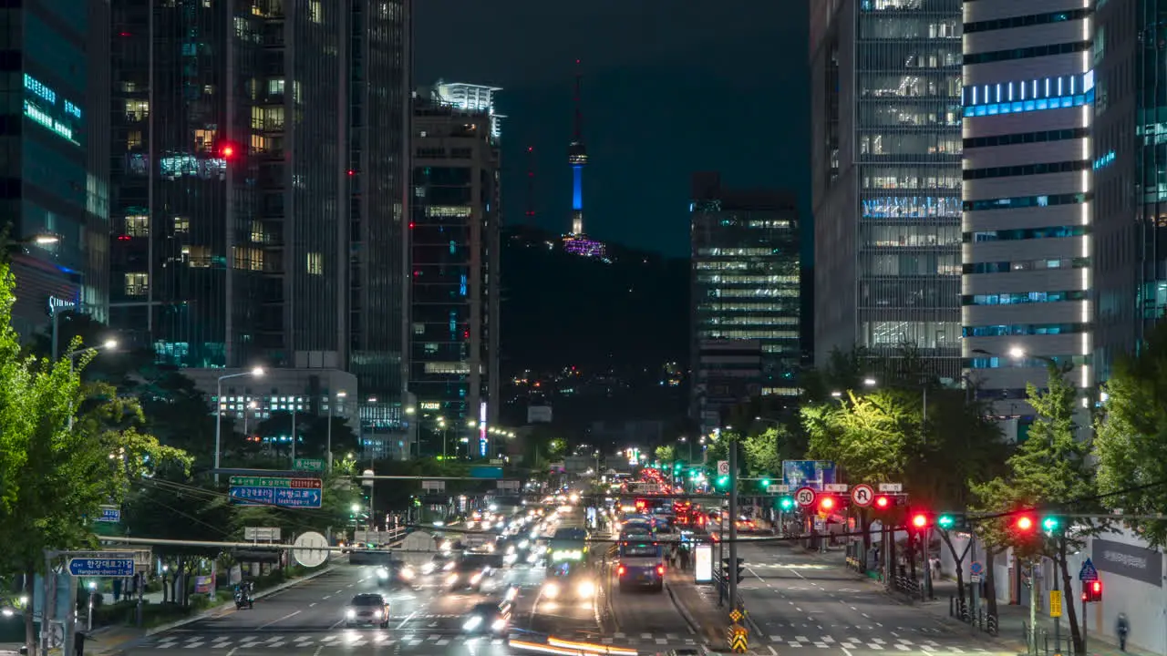 Night Seoul Busy Yongsan Station Traffic on Crossroad With View of Namsan Tower Zoom out Timelapse