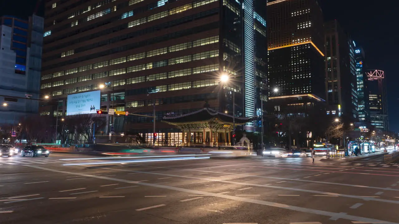 Night City Traffic Timelapse on Crossroads of Sejong-daero and Jong-ro Roads by Gwanghwamun Station in Seoul South Korea zoom out motion