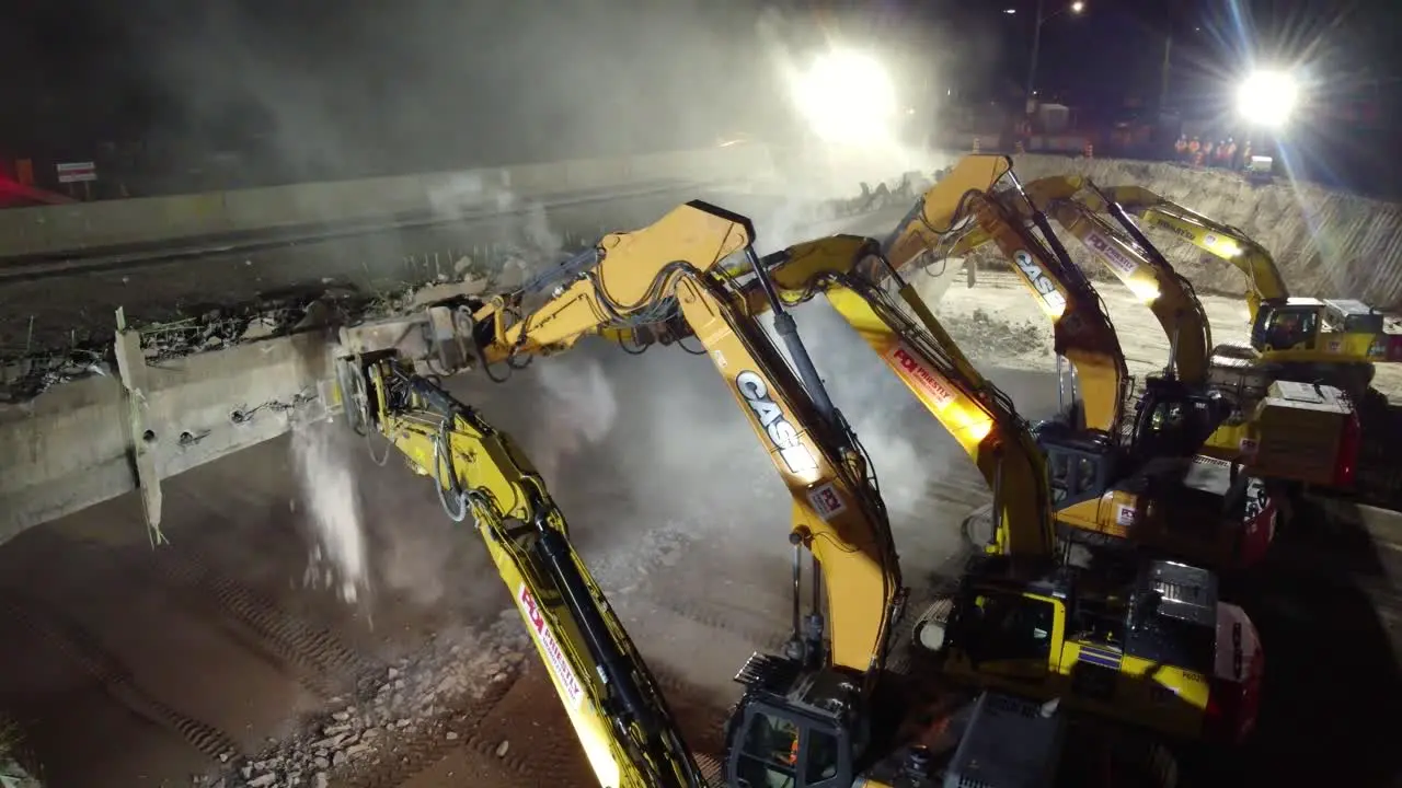 Excavators At Work Demolishing Road Bridge At Night In Barrie Canada