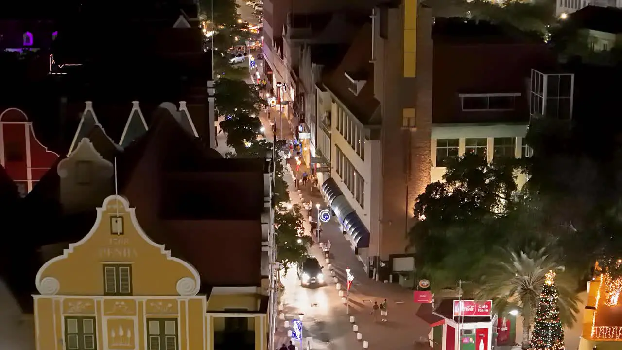 Handelskade Punda road at night with Christmas lights around Queen Emma Bridge aerial drone