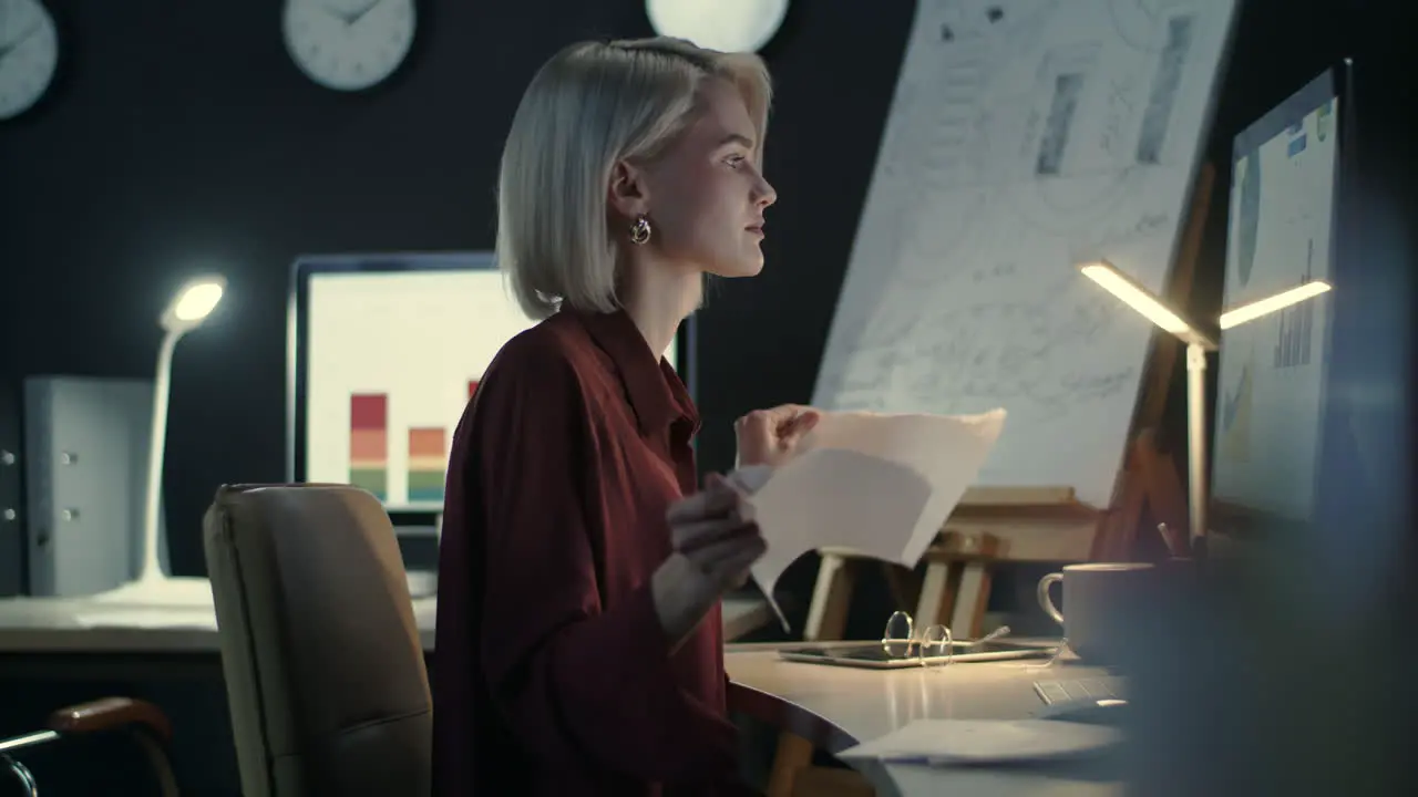 Upset business woman writing document in office Business woman tearing paper