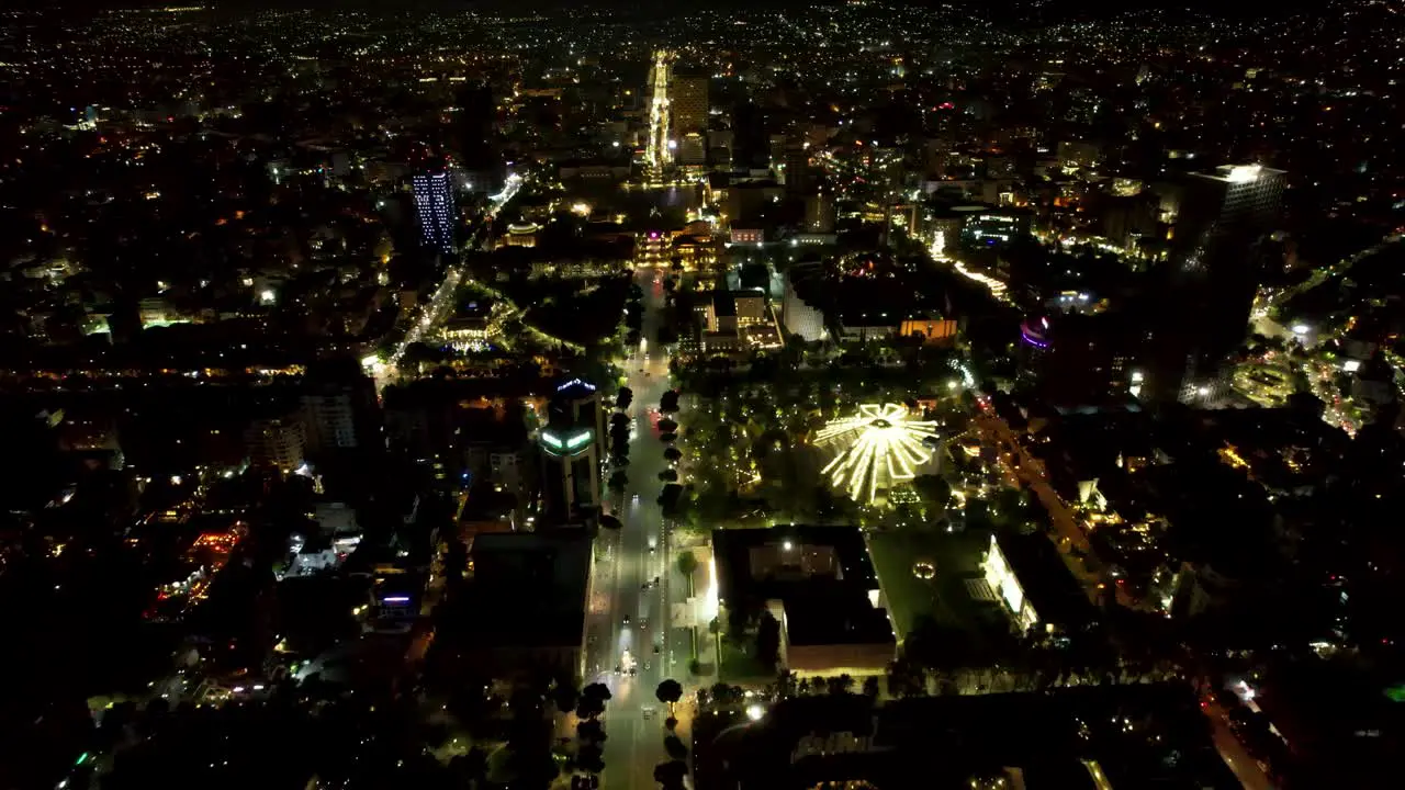 Tirana by Night Aerial Drone View of the Capital City's Beautiful Boulevard Illuminated with Dazzling Lights and Urban Splendor