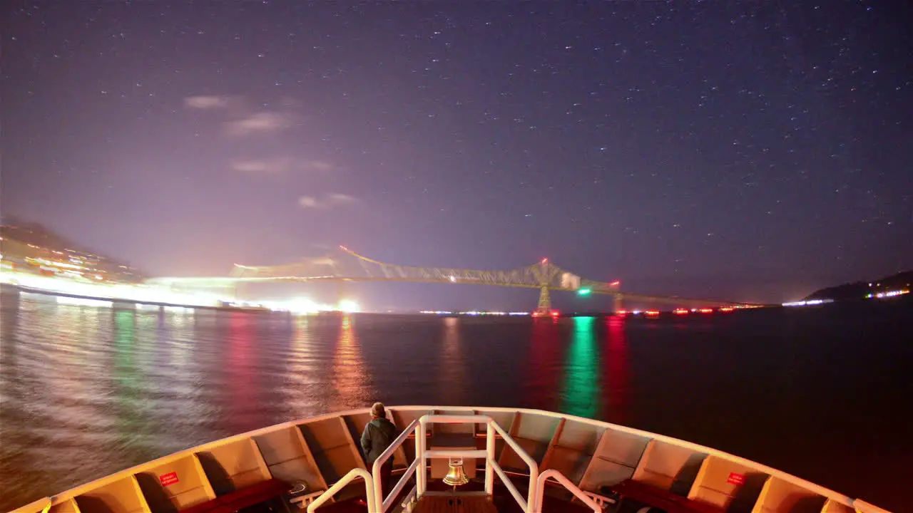 POV timelapse of a ship traveling under the Astoria‰ÛÒMegler Bridge on the Columbia River between Washington and Oregon at night