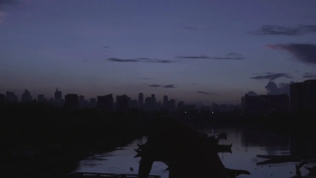 Panning Shot Of A River With Small Boats At Dusk 4K