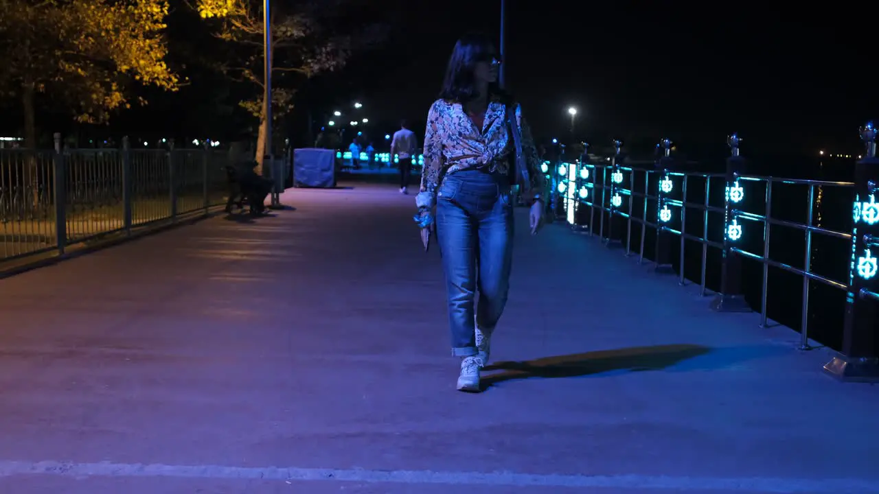 Woman walking on night