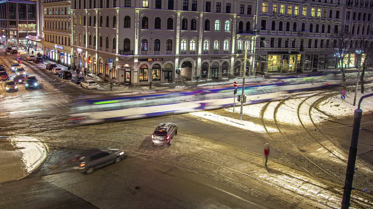 Time lapse main intersection at night during winter snow on ground Riga Latvia