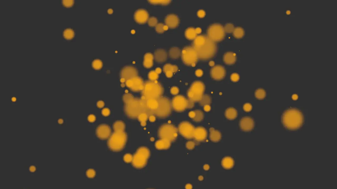 Flying gold round particles with glitters on fashion black gradient