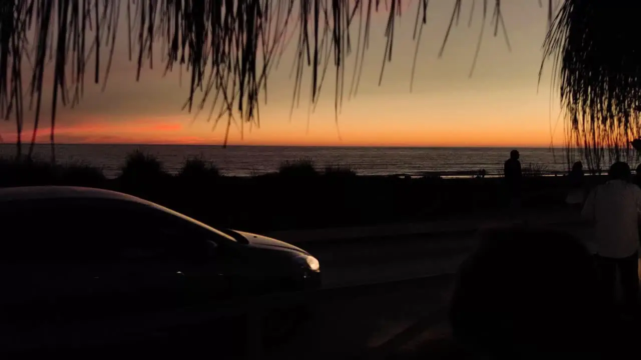 silhouette at sunset in a beach bar with