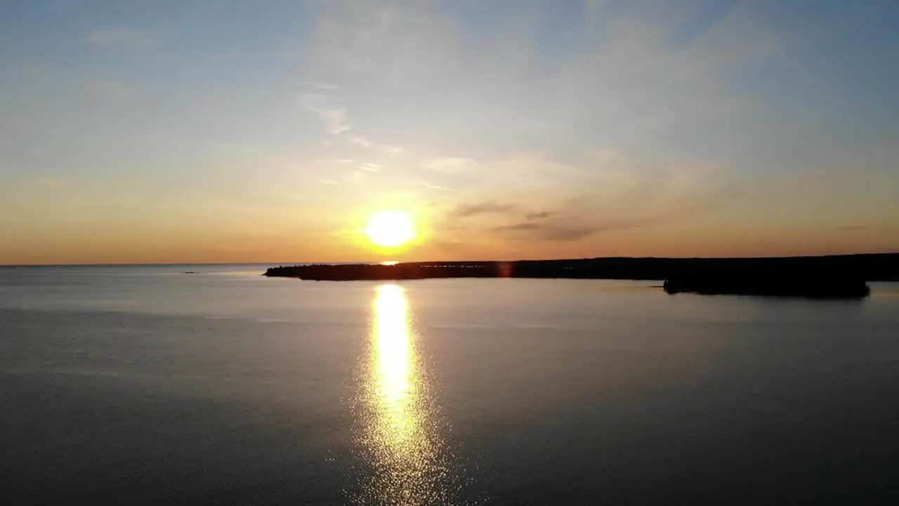 Golden hour over body of water with water and islands