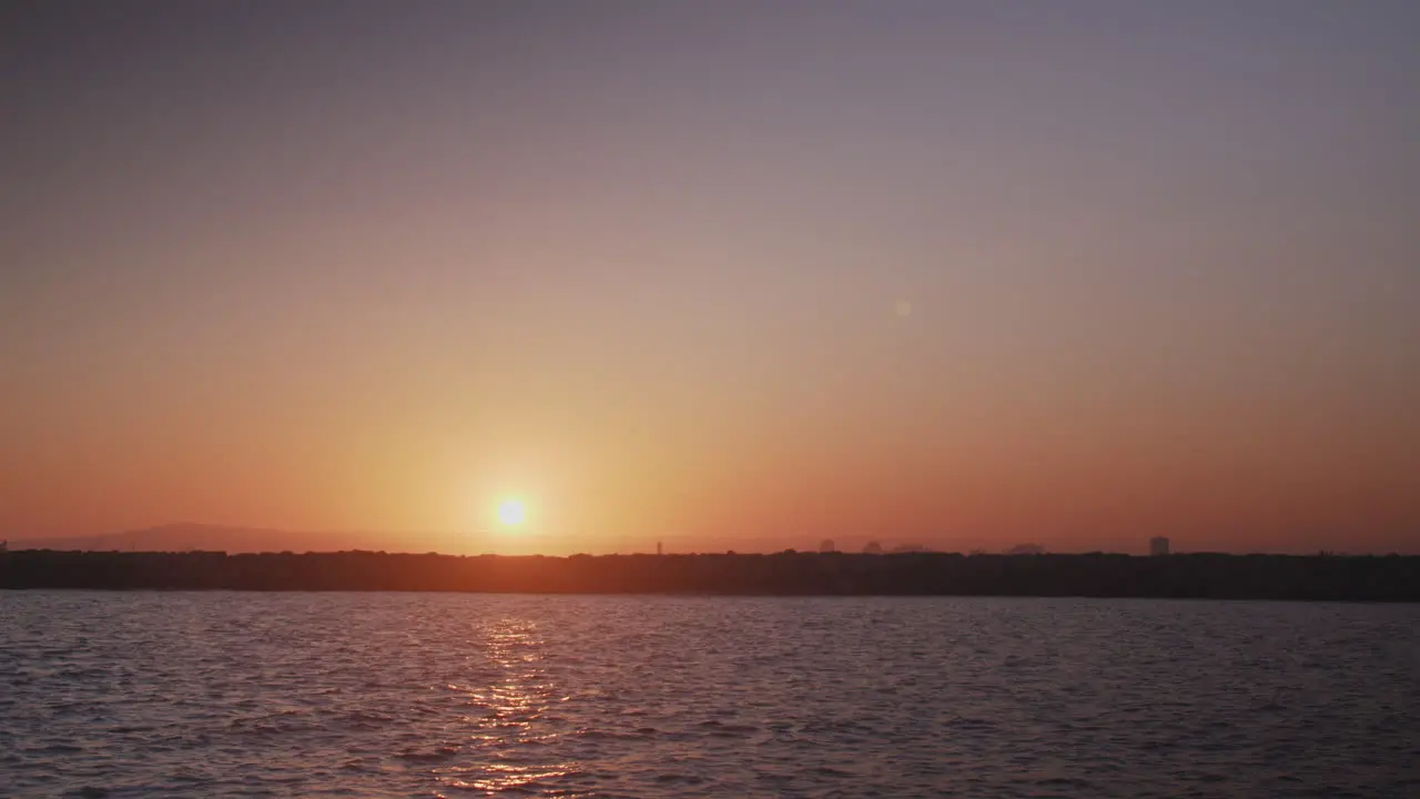 Dramatic sunset over ocean canal