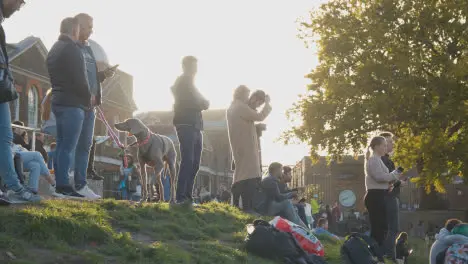 People Outside The Royal Observatory In Greenwich Park London UK At Sunset 1