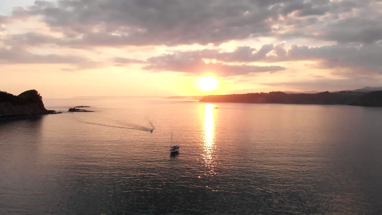 Sailing Boat in Sunset Drone view fly around