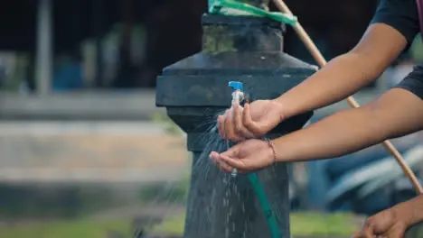 Close Up Shot of People Washing Hands in Bali