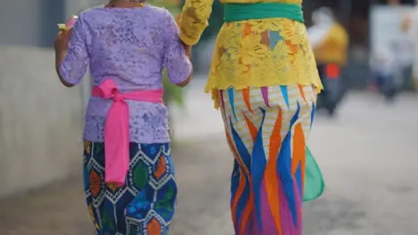 Tracking Shot of Young Girls Walking Through Bali