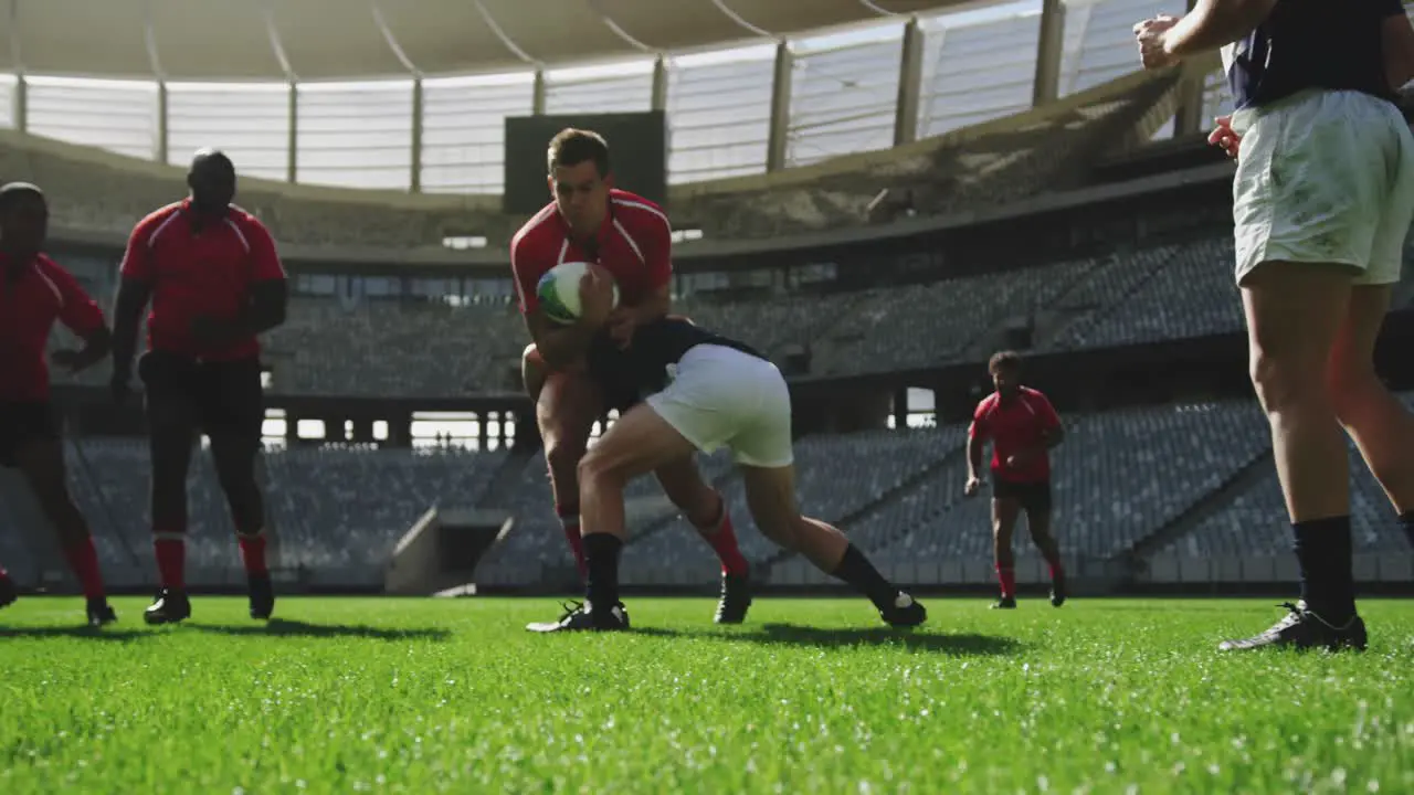 Rugby players playing rugby match in stadium 4k