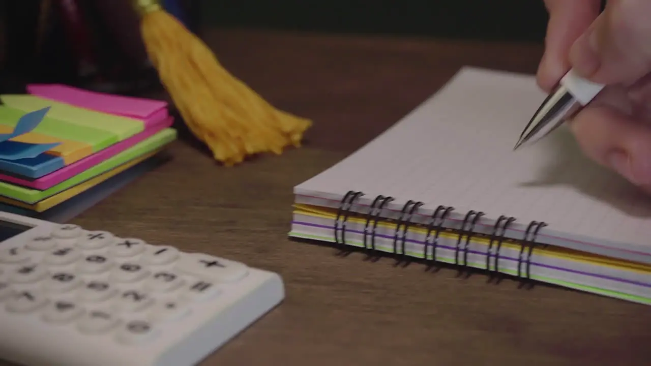 Hands Using A School Calculator And Doing Math Exercises In A Notebook