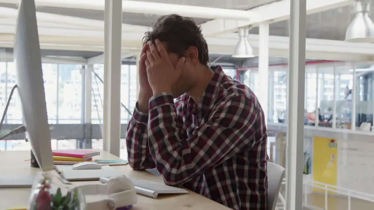 Young man working in a creative office