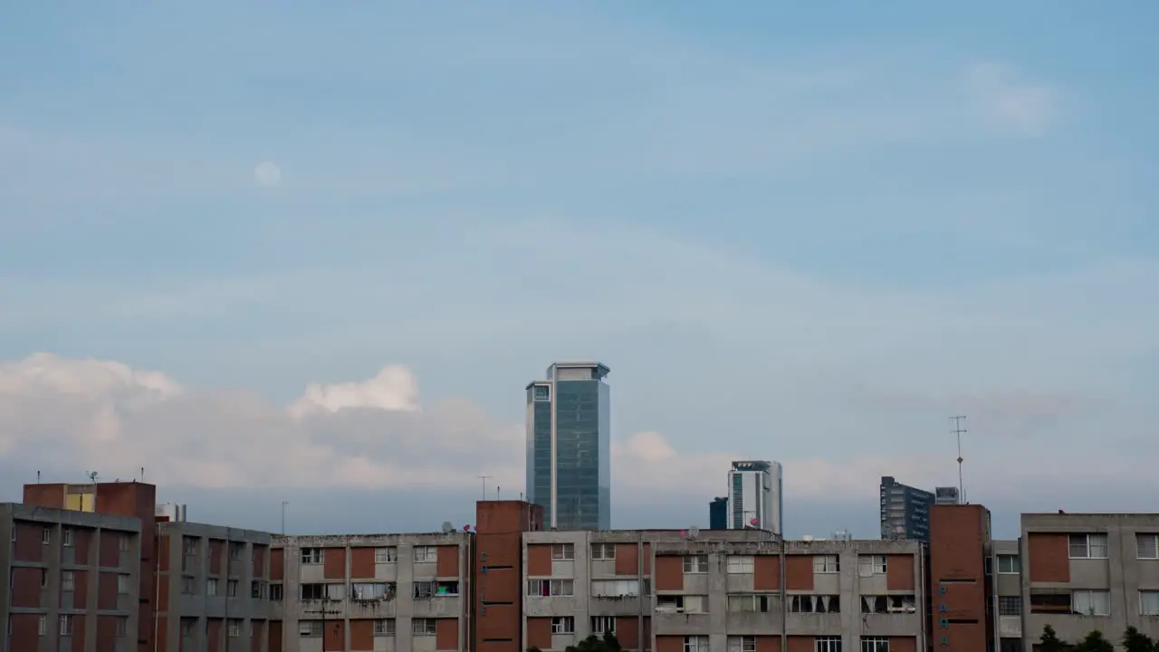 Time lapse of moon setting in the morning with clouds in Mexico City