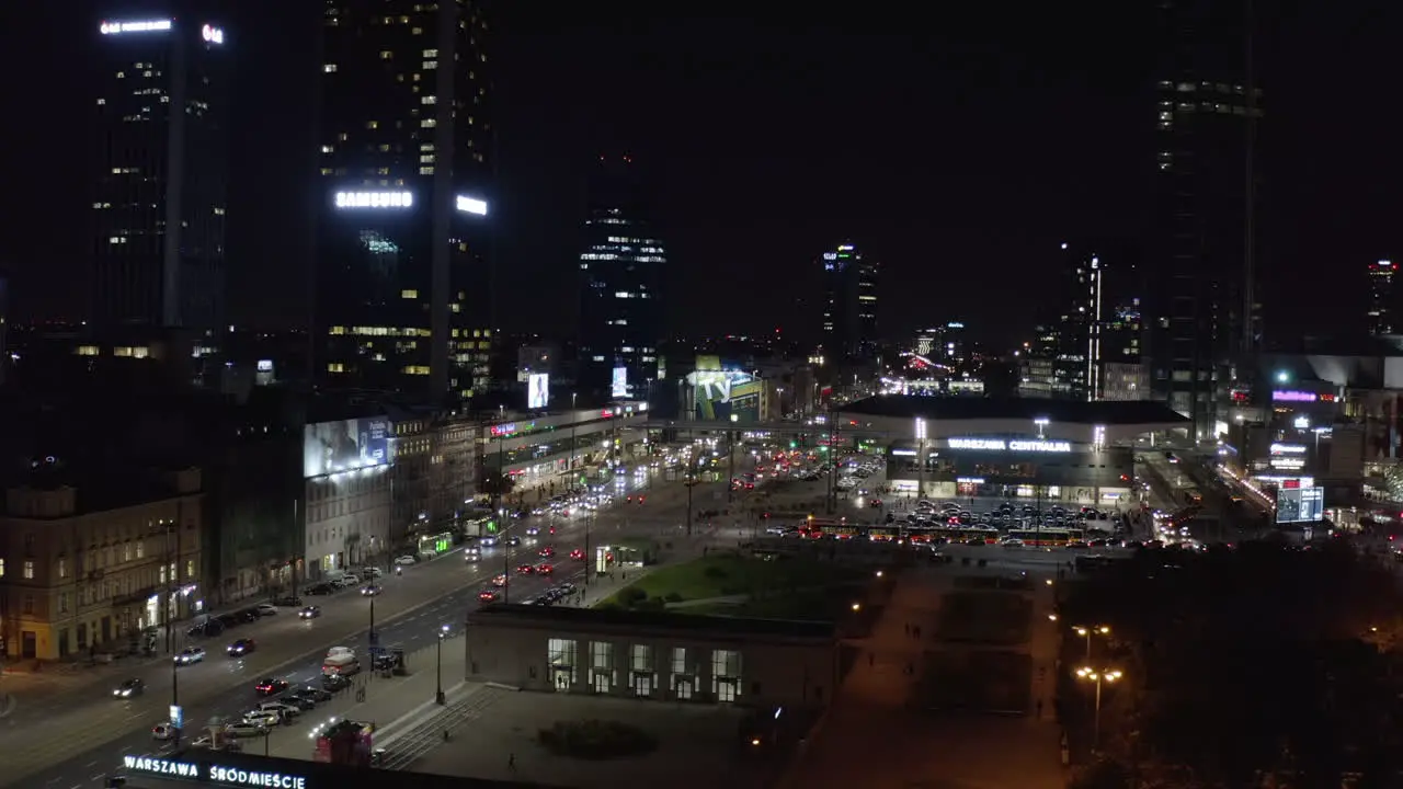 Forwards fly above night streets of city Busy multilane road in downtown Individual and public transportation Warsaw Poland