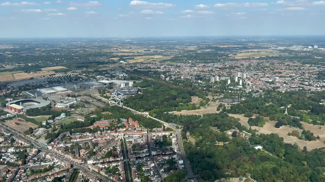 Aerial view from a jet cockpit of the western part of Brussels city Belgium taken at 300m high during the approach with the Atomiun in the scene