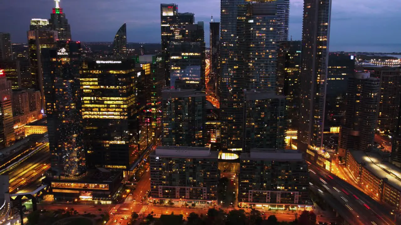 Hyperlapse of buildings in South Core traffic and the railway station in Toronto Canada pull back aerial