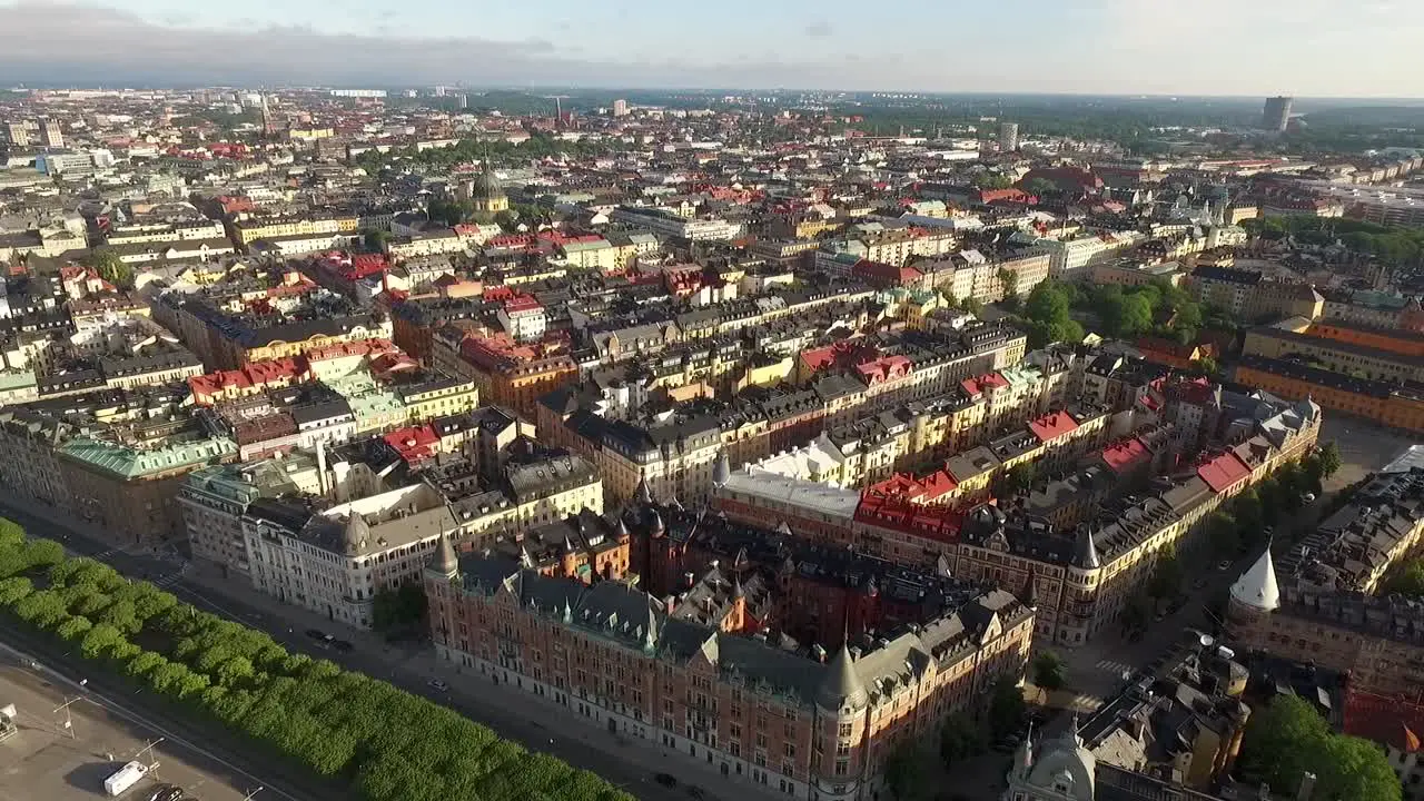 An aerial view shows of Stockholm Sweden pulls back to show boats docked outside the city