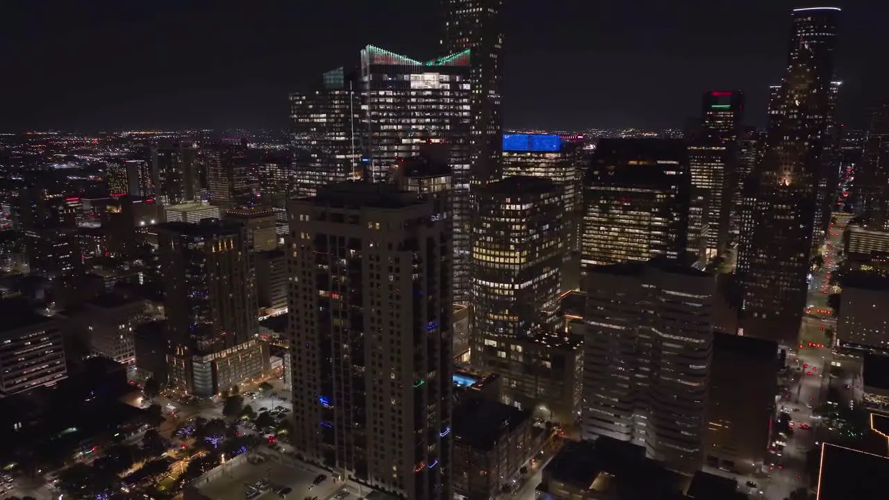 Aerial view overlooking luxury residence roofs dusk in Houston USA circling drone shot