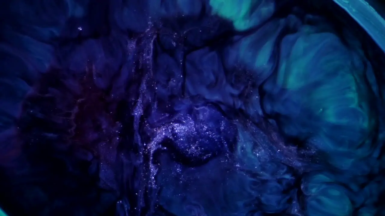 A teeming cauldron bubbles and churns its purples and blues oh my