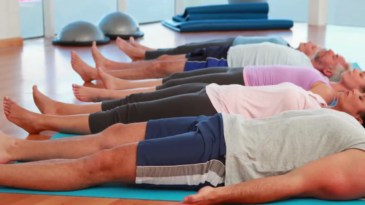 Yoga class lying down in relaxation