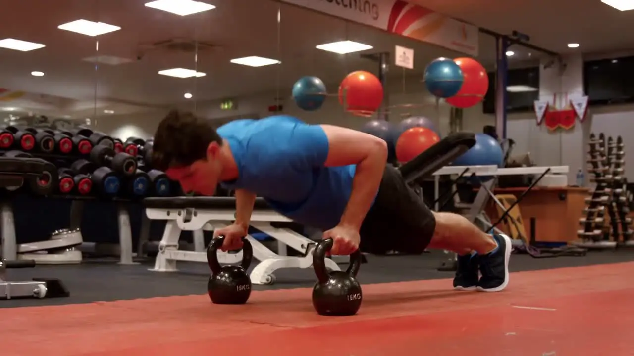 Man doing push ups in gym