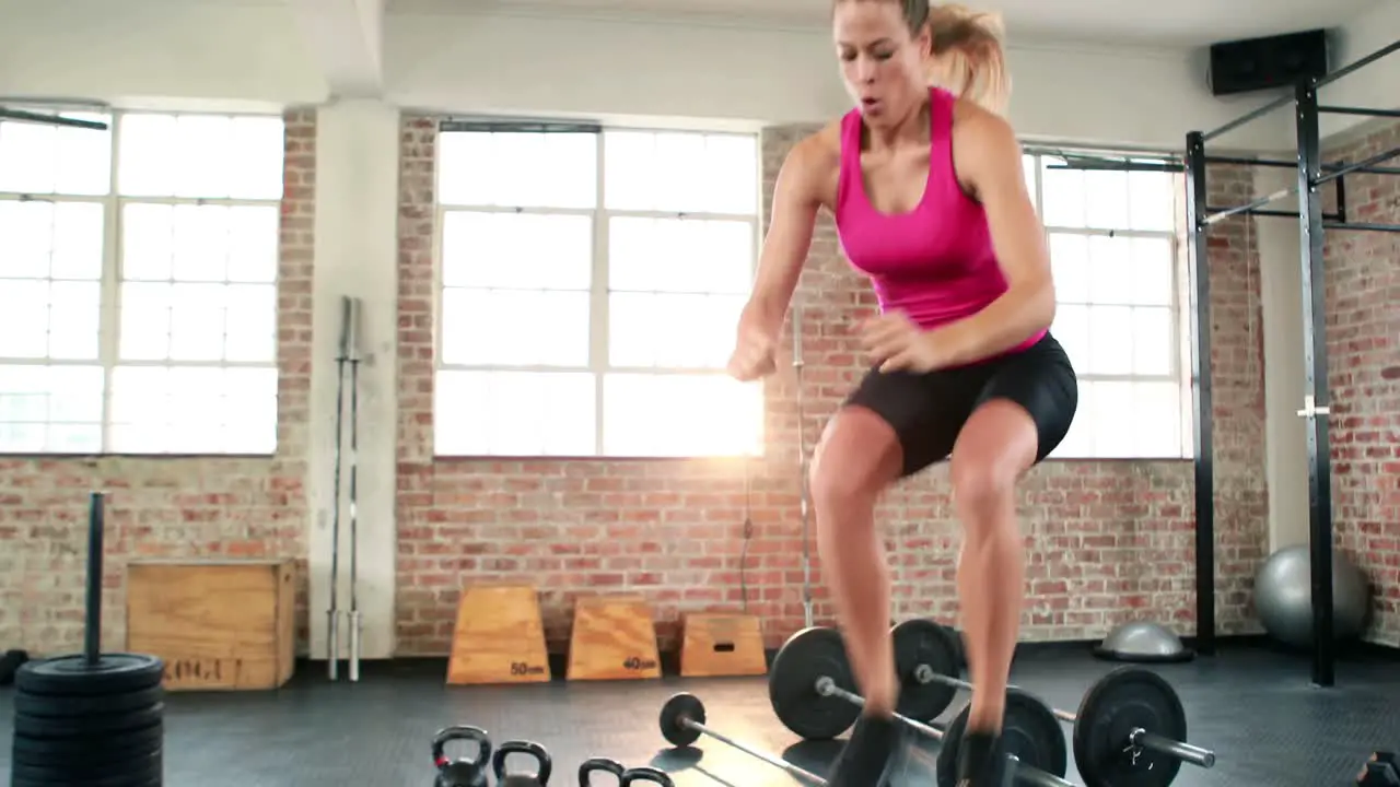 Fit woman doing box jumps