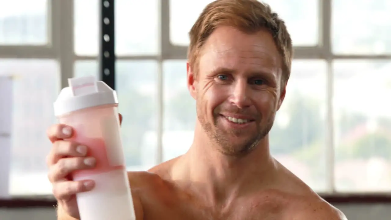 Fit man making his protein shake