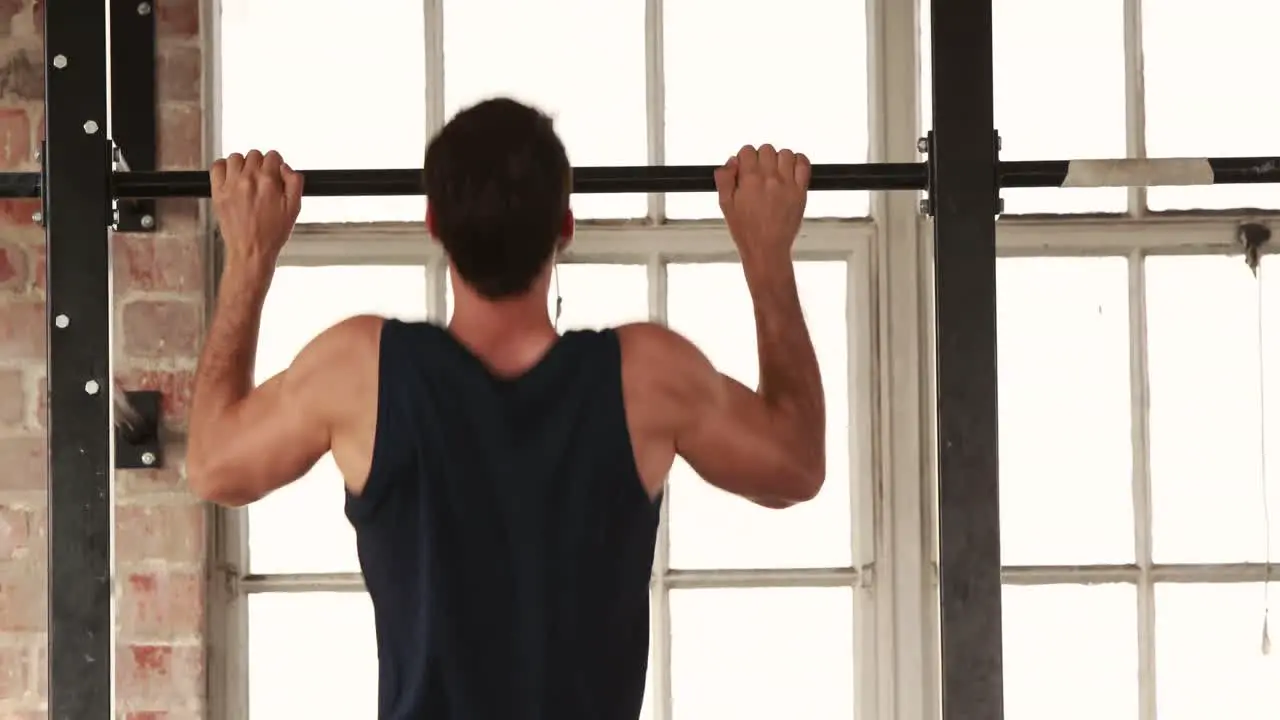 Fit man doing some pull ups