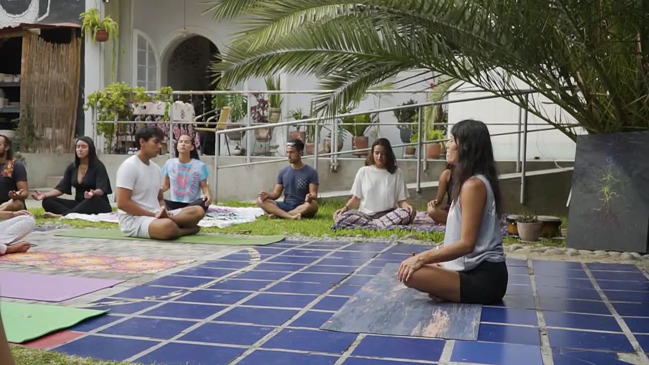 Yoga Coach Meditating In Yoga Session In Nature With Her Students Lima Peru