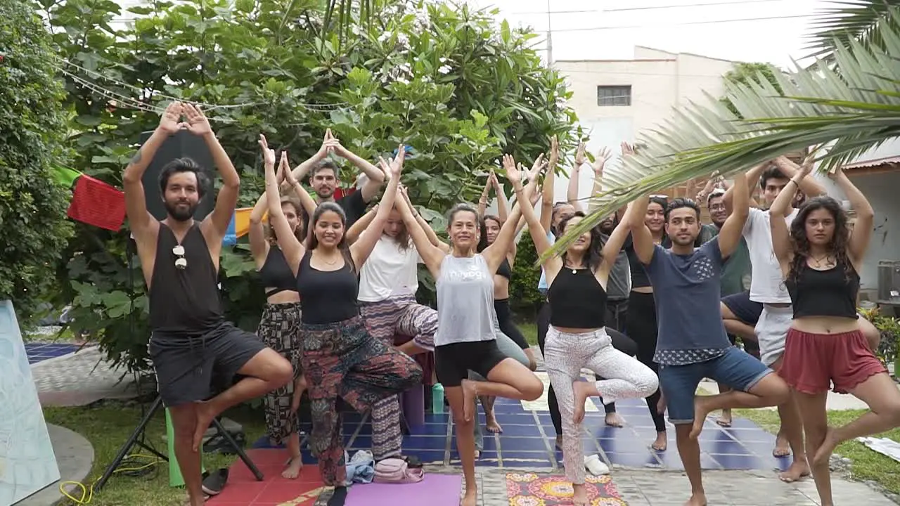 Group Of People Posing In Home's Yard Breathing And Stretching Lima Peru