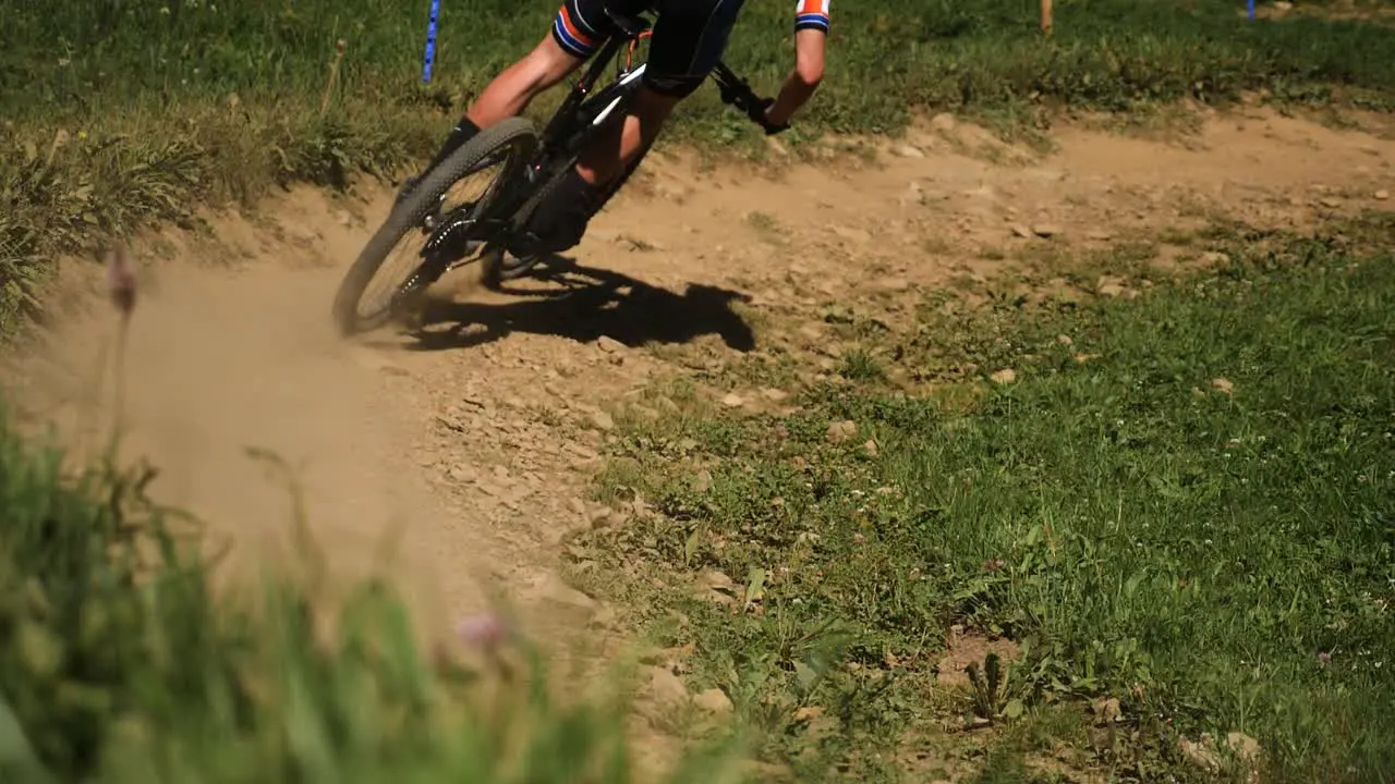 Pan of Cyclist Cycling Round Dirt Track