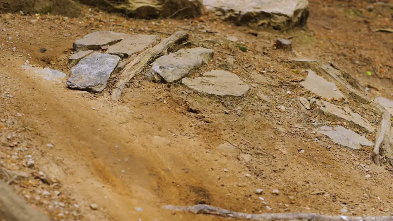 Close Up Bike Wheel Passing on Dirt Track